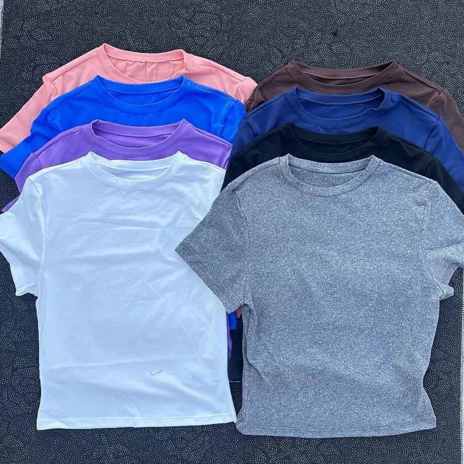 Solid color women's soft breathable yoga short-sleeved comprehensive training tight T-shirt with exposed belly button