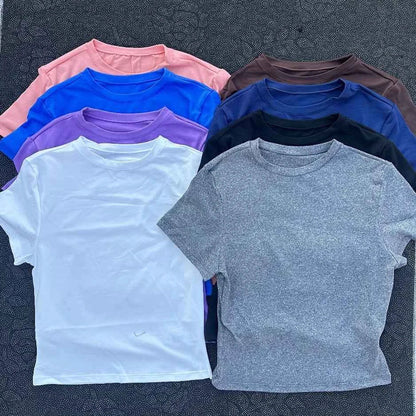 Solid color women's soft breathable yoga short-sleeved comprehensive training tight T-shirt with exposed belly button