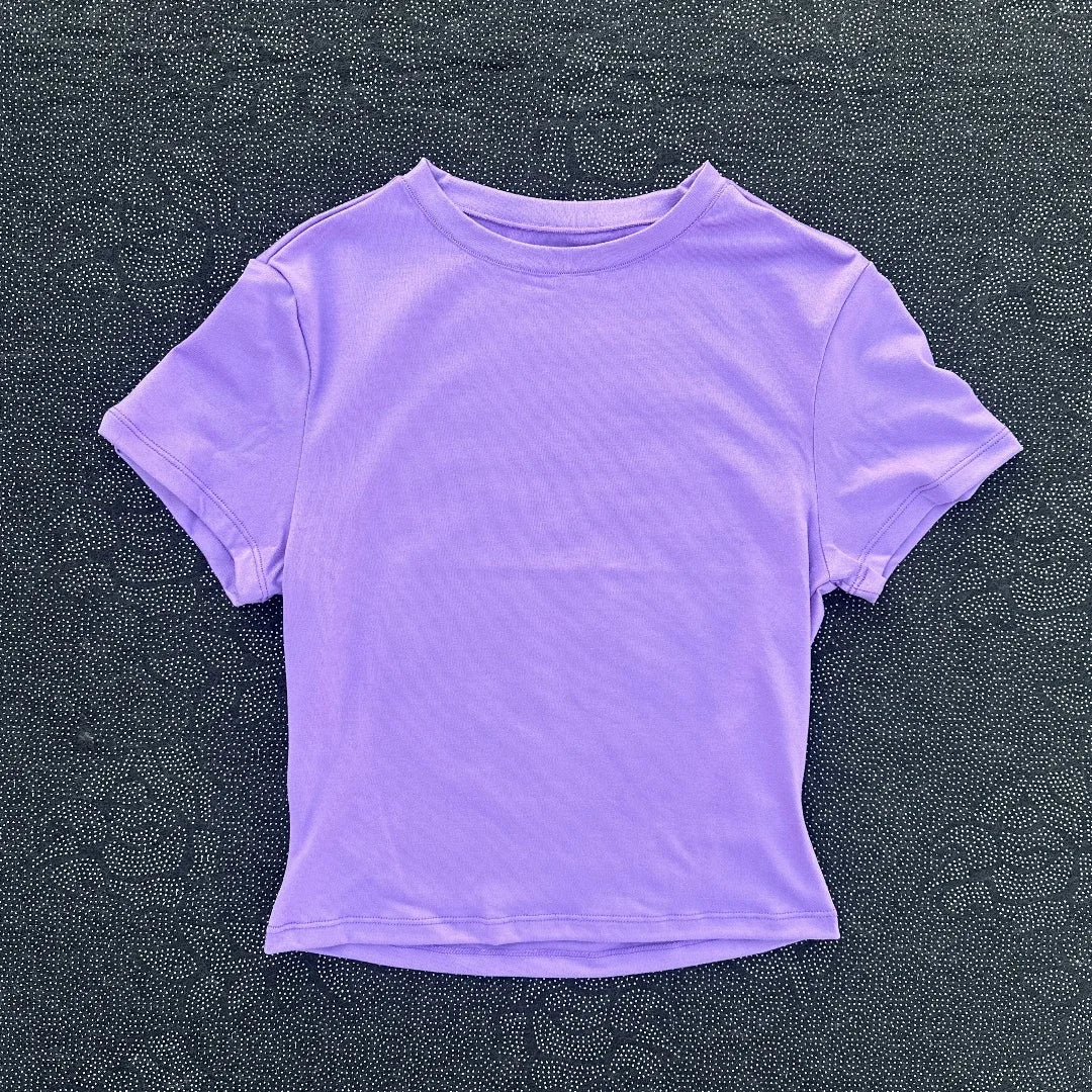 Solid color women's soft breathable yoga short-sleeved comprehensive training tight T-shirt with exposed belly button