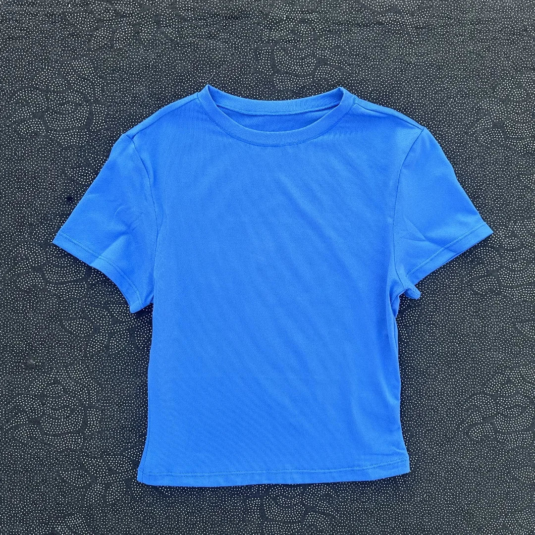 Solid color women's soft breathable yoga short-sleeved comprehensive training tight T-shirt with exposed belly button