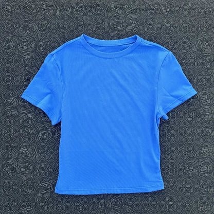 Solid color women's soft breathable yoga short-sleeved comprehensive training tight T-shirt with exposed belly button